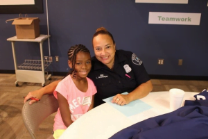 Detroit police team with kids for photography project and a surprise